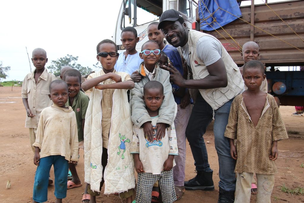 Donel Jack’sman with children in Gado camp