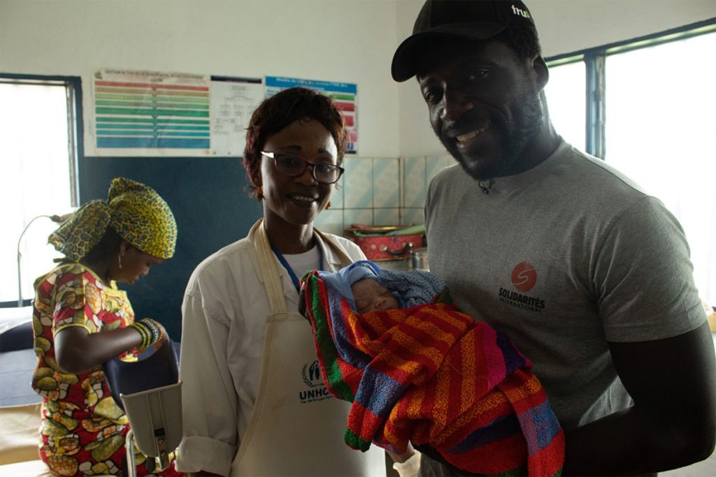 Donel Jack’sman, Valerie the AHA midwife and Central African refugee and the new-born baby