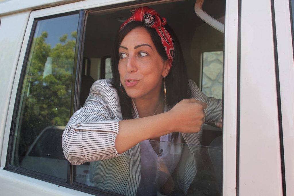 Faïza in the car in Port-au-Prince